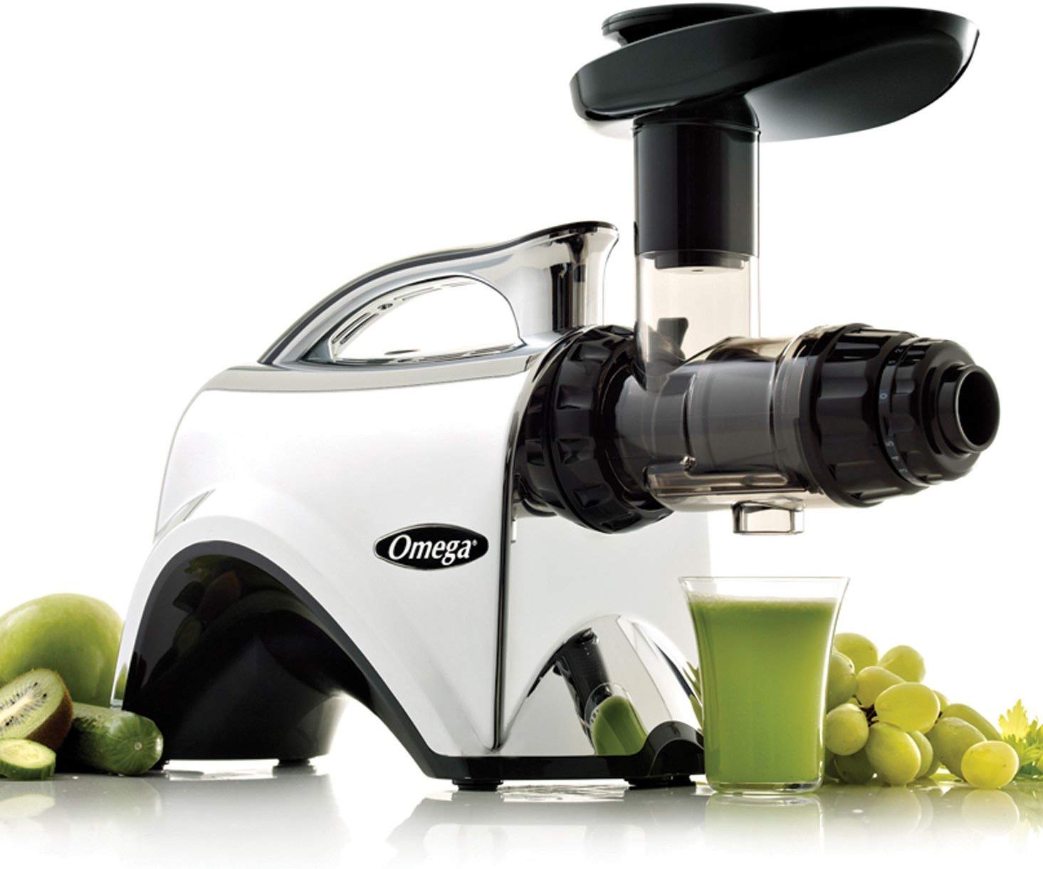 omega nc900hdc juicer next to grape and green juice