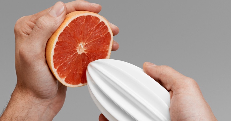 hand-squeezing grapefruit