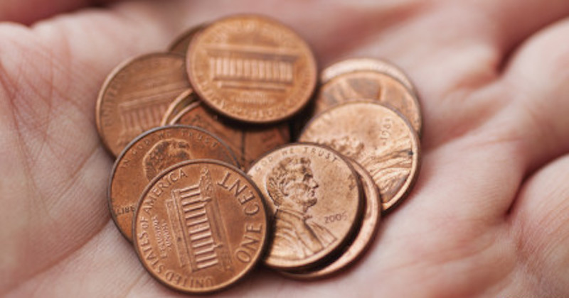 copper pennies in hand