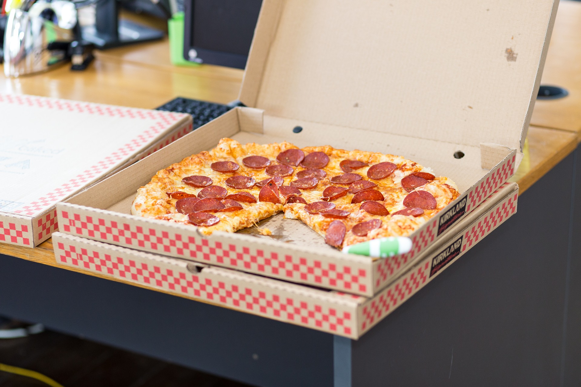Open box showing pepperoni pizza