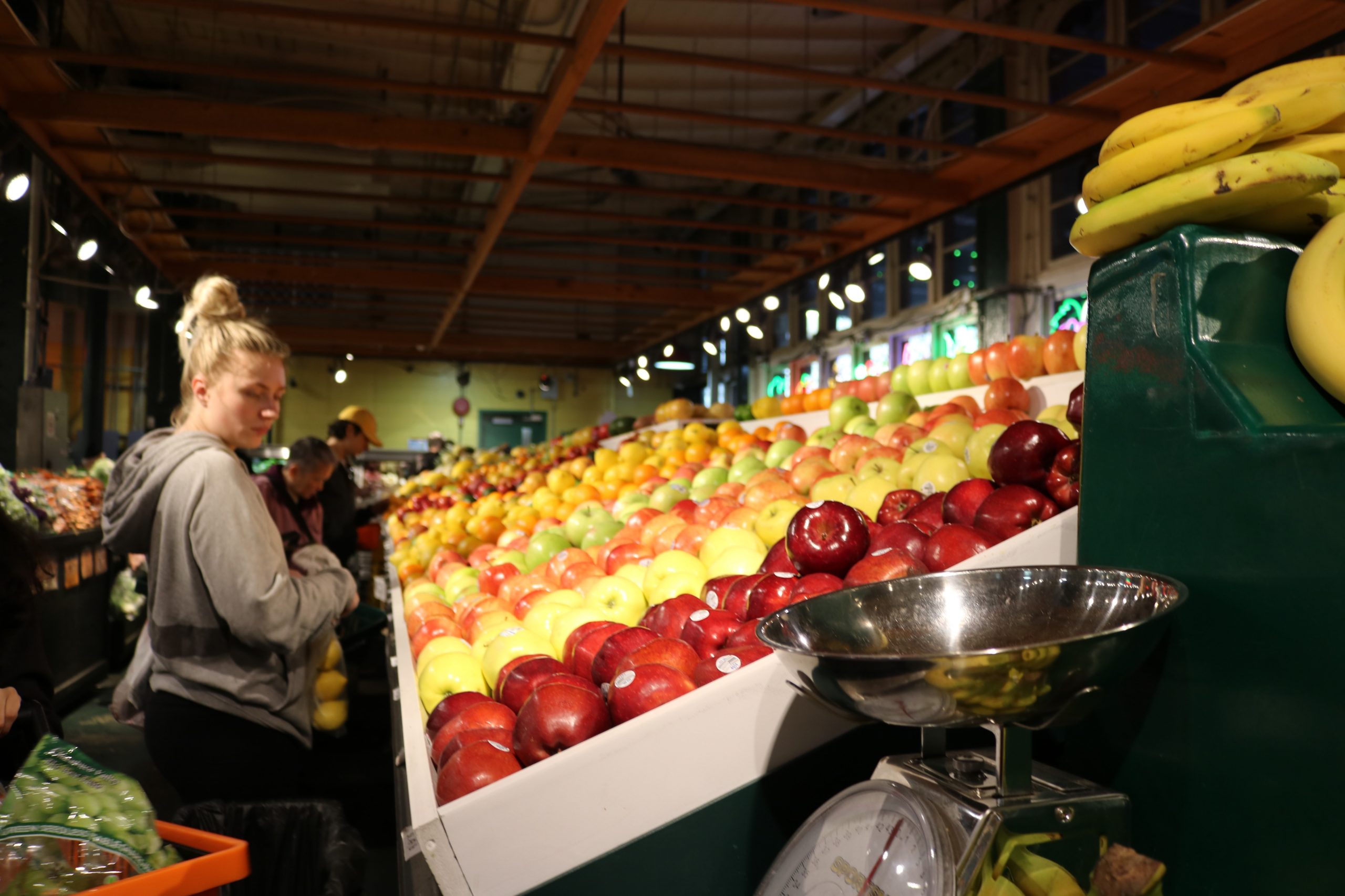 women shopping in produce section