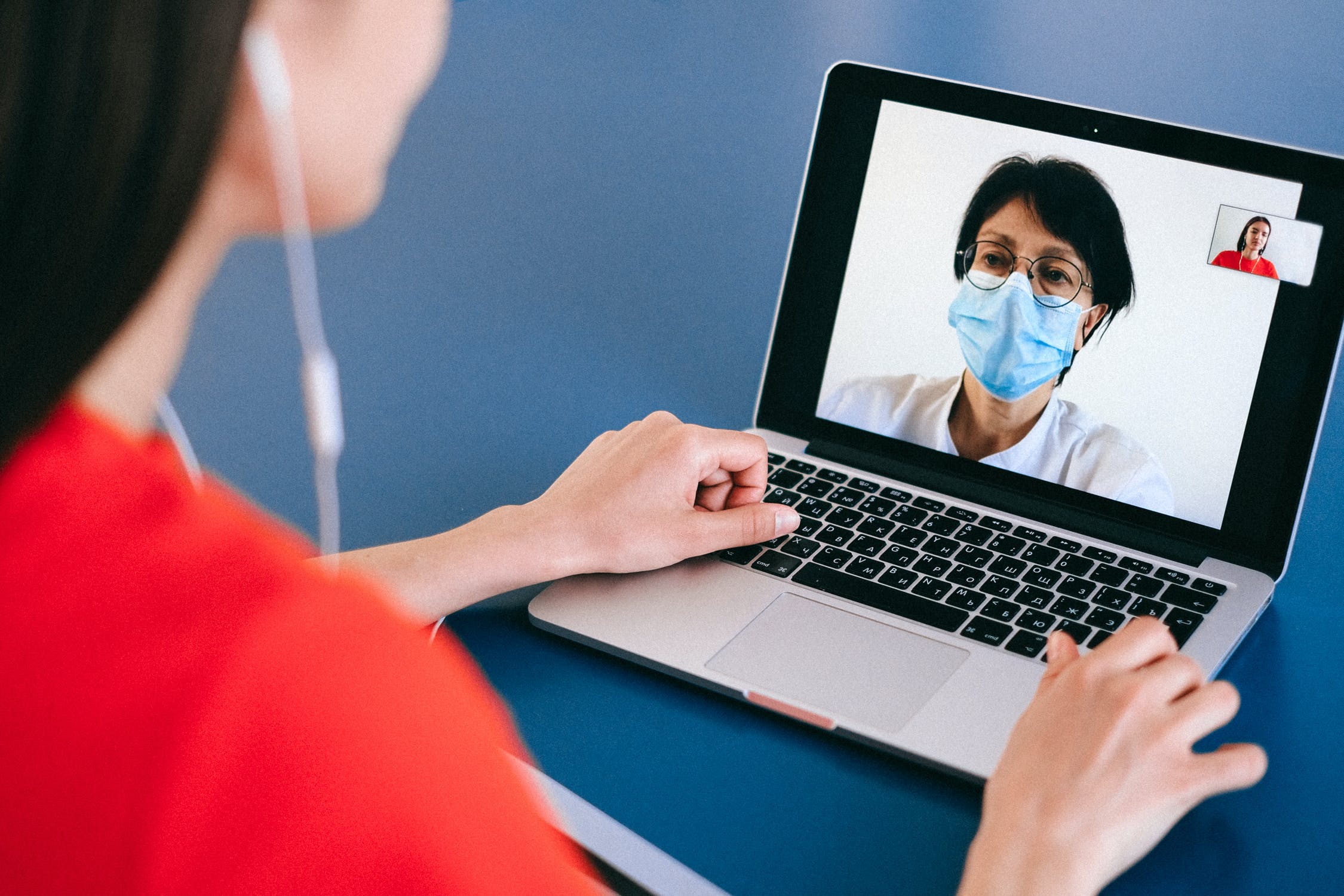 Woman using telehealth to communicate with doctor